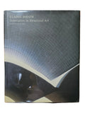 Book titled 'Eladio Dieste: Innovation in Structural Art' on a wooden surface