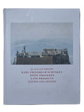 Book with cover featuring a photograph of classical architecture on a wooden surface