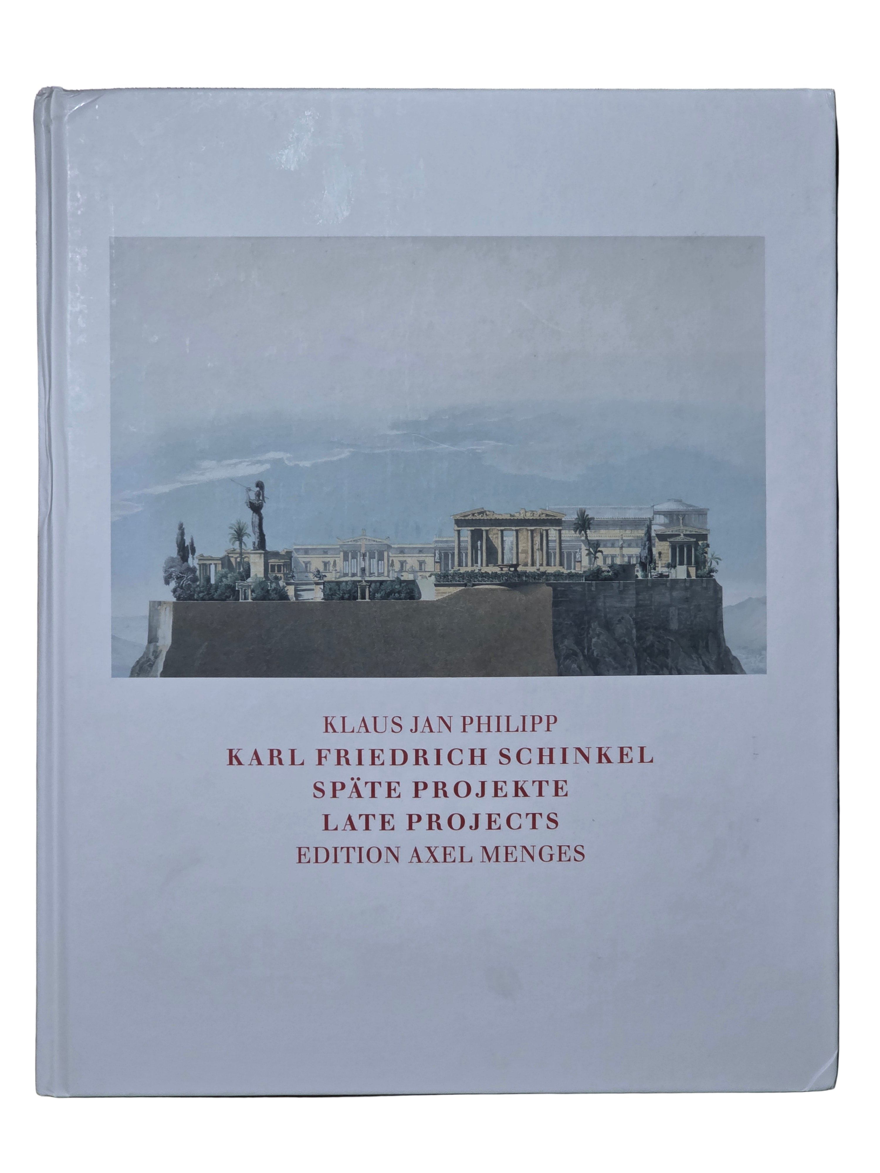 Book with cover featuring a photograph of classical architecture on a wooden surface